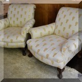F09. Pair of ivory colored upholstered armchairs with gold urn-shaped pattern. 